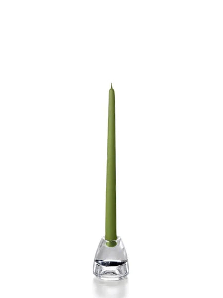 Twelve inch green coloured tapper candle for sale shown on a white background on a clear candle holder. 