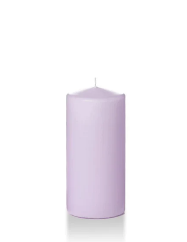 Lilac coloured six inch pillar candle shown for sale on a white background.