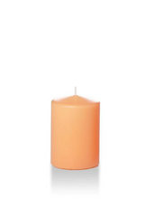 Load image into Gallery viewer, Peach coloured four inch tall pillar candle shown for sale on a white background.
