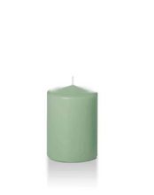 Load image into Gallery viewer, Blue green coloured four inch tall pillar candle shown for sale on a white background.
