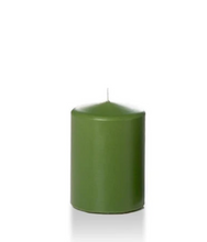 Load image into Gallery viewer, green coloured four inch tall pillar candle shown for sale on a white background.
