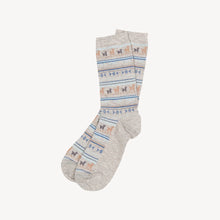 Load image into Gallery viewer, Light gray socks shown for sale on a white backround. The socks have a patten that includes alpacas, lines, dots and shapes in the colours of blues and browns.
