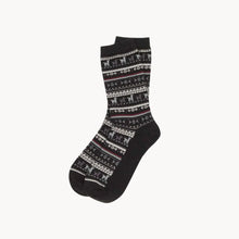 Load image into Gallery viewer, Black socks are shown for sale on a white background. The socks have a patten with alpacas, lines, dots and shapes in the colours grey, red and white.

