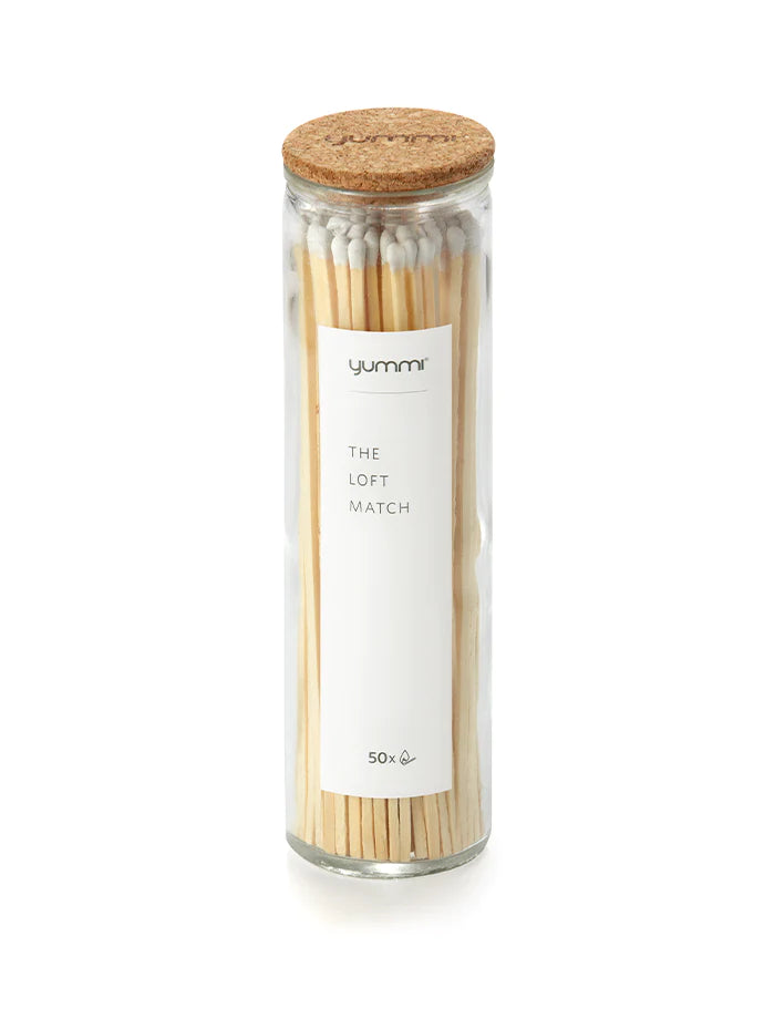Matches shown in a clear bottle with a cork lid. On the label reads yummi the loft match 50x.