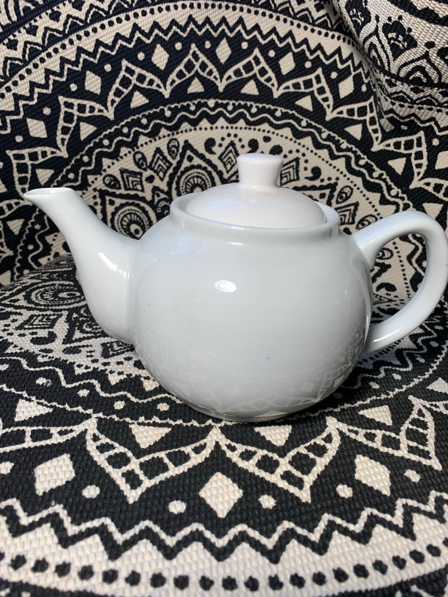 Small white teapot