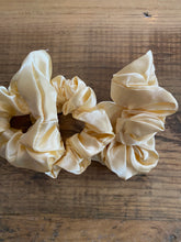 Load image into Gallery viewer, Pale Yellow satin scrunchy hair tie.
