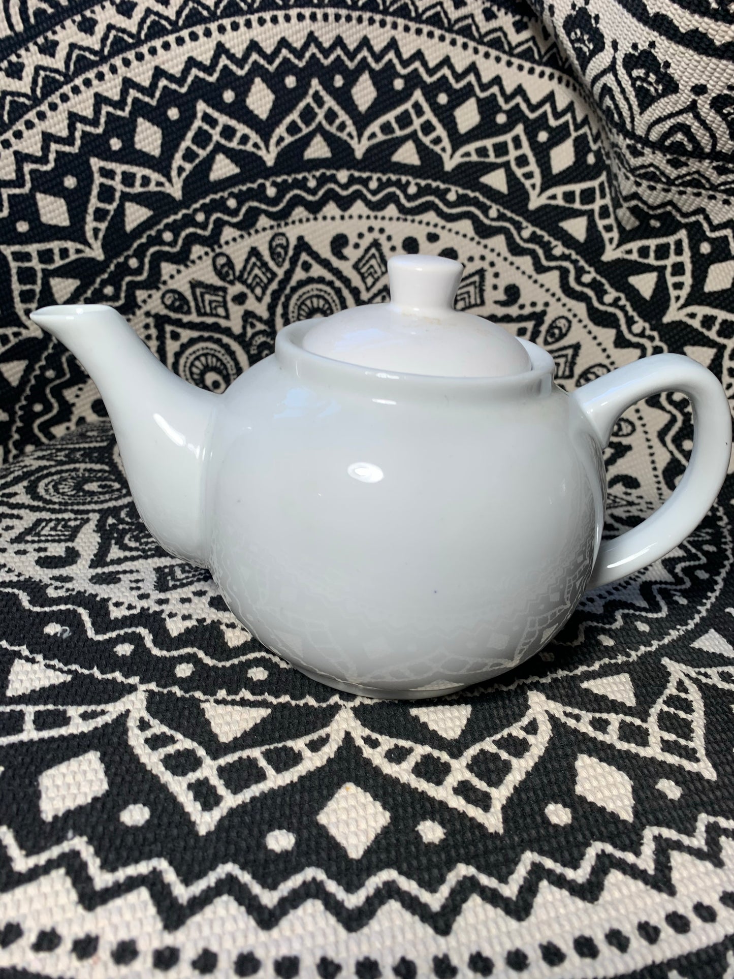 Small white teapot