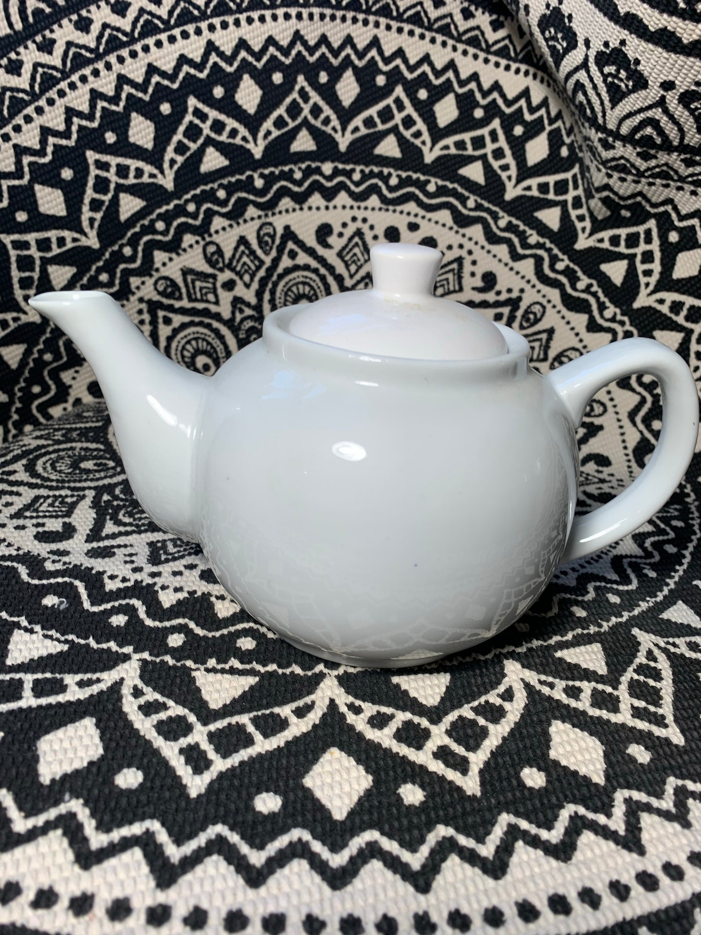 Small white teapot